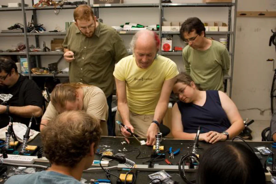 Mitch Altman demonstrating soldering at a soldering station Mitch Altman demonstrating soldering at a soldering station